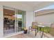 Relaxing outdoor patio featuring table and chairs, and an open view to the eat in kitchen at 3860 Cobblestone Ln, Punta Gorda, FL 33980