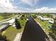 Aerial view of a canal community featuring waterfront homes, docks and lush greenery at 4045 Conway Blvd, Port Charlotte, FL 33952