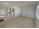 Spacious living room with tile flooring, natural light, and neutral paint at 4045 Conway Blvd, Port Charlotte, FL 33952