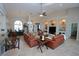 Spacious living room featuring high ceilings, built-in shelving, and comfortable leather furniture at 507 Saint Girons Ct, Punta Gorda, FL 33950