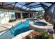 Lovely backyard pool and hot tub with screened lanai, offering a private waterfront oasis at 507 Saint Girons Ct, Punta Gorda, FL 33950