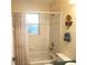 Cozy bathroom featuring a bathtub and decorative tile at 5098 Adina Cir, North Port, FL 34291