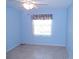 Inviting bedroom with tile floor and a sunny window at 5098 Adina Cir, North Port, FL 34291