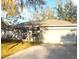 Charming single-story home with a two-car garage and well-maintained landscaping in a tranquil setting at 5098 Adina Cir, North Port, FL 34291
