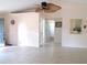 Open living room featuring tile floors, ceiling fan, and doorway to bathroom at 5098 Adina Cir, North Port, FL 34291