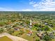 An aerial view of a neighborhood showcases the home's location within a desirable community and luscious green landscape at 5126 Richmond Ter, North Port, FL 34287