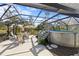 Backyard pool with screened enclosure and plenty of seating for outdoor relaxation at 5126 Richmond Ter, North Port, FL 34287