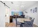 Cozy dining area featuring a round table and chairs, with a view of the bright living room at 5126 Richmond Ter, North Port, FL 34287