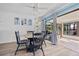 This dining room features seaside decor with a large window, allowing you to enjoy the outdoor view at 5126 Richmond Ter, North Port, FL 34287