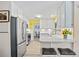 Well-lit kitchen with stainless steel appliances and bar seating at 5126 Richmond Ter, North Port, FL 34287