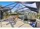 Outdoor living space includes a screened-in patio with above ground pool, dining area, and lounge seating at 5126 Richmond Ter, North Port, FL 34287