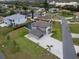 A captivating aerial view showcasing a modern two-story house, pool, and manicured landscaping at 5636 Barlow Ter, North Port, FL 34287