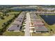Aerial shot of a home in a planned community with a beautiful pond and manicured landscaping at 7304 W Lenox Circle, Punta Gorda, FL 33950