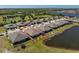 Aerial view of a home with a backyard overlooking a pond in a well-planned residential community at 7304 W Lenox Circle, Punta Gorda, FL 33950