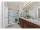 Bright bathroom with a glass shower, double sinks, and a neutral color palette at 7304 W Lenox Circle, Punta Gorda, FL 33950