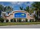 Welcoming entrance sign for Waterford community surrounded by lush tropical landscaping at 7304 W Lenox Circle, Punta Gorda, FL 33950