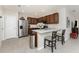 Kitchen with stainless steel appliances, breakfast bar, and ample counter space for meal preparation at 7304 W Lenox Circle, Punta Gorda, FL 33950