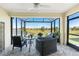 Screened lanai with comfortable seating and views of the lake at 7304 W Lenox Circle, Punta Gorda, FL 33950