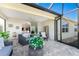 Outdoor screened-in lanai featuring comfortable seating and neutral decor at 7304 W Lenox Circle, Punta Gorda, FL 33950