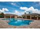 Resort-style pool with covered cabanas provides a luxurious space for outdoor relaxation and entertainment at 7304 W Lenox Circle, Punta Gorda, FL 33950