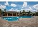 Sparkling community pool with ample seating and shaded cabana area is ideal for socializing at 7304 W Lenox Circle, Punta Gorda, FL 33950