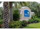 Entrance sign to Waterford community featuring lush landscaping and vibrant flowers at 7304 W Lenox Circle, Punta Gorda, FL 33950
