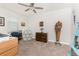 Cozy study with carpet flooring, a ceiling fan, and decorative furnishings like a blue ladder shelf and patterned chair at 7304 W Lenox Circle, Punta Gorda, FL 33950
