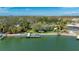 Arial view of the home showcasing the dock, the serene backyard, and the canal at 75 Spyglass Aly, Placida, FL 33946