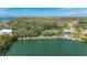 Aerial view of the waterfront property showcasing private dock and scenic surroundings at 75 Spyglass Aly, Placida, FL 33946