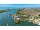 Aerial view of waterfront property showing surrounding landscape and neighborhood at 75 Spyglass Aly, Placida, FL 33946