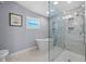Modern bathroom with a glass-enclosed shower and a soaking tub at 75 Spyglass Aly, Placida, FL 33946