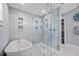 Bathroom showcasing a glass shower and freestanding tub at 75 Spyglass Aly, Placida, FL 33946
