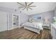 Bright bedroom with a ceiling fan, ensuite bathroom, and calming paint at 75 Spyglass Aly, Placida, FL 33946