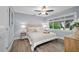 Cozy bedroom with hardwood floors and a large window at 75 Spyglass Aly, Placida, FL 33946