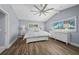 Well-lit bedroom with vaulted ceiling, large windows, and light blue walls at 75 Spyglass Aly, Placida, FL 33946