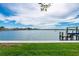 Waterfront view featuring private dock with boat lift at 75 Spyglass Aly, Placida, FL 33946