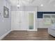 Bright entryway with wood-look tile flooring, leading to a spacious living area at 75 Spyglass Aly, Placida, FL 33946
