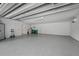 Spacious garage featuring sealed concrete floors, ample lighting and storage; perfect for projects and parking at 75 Spyglass Aly, Placida, FL 33946