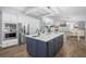 Modern kitchen with stainless steel appliances, a large island, and lots of storage at 75 Spyglass Aly, Placida, FL 33946