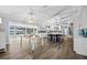 Bright kitchen boasts wood floors, island with seating, and views of the water at 75 Spyglass Aly, Placida, FL 33946