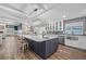 Bright kitchen with a large island featuring a sink and seating at 75 Spyglass Aly, Placida, FL 33946