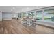 Open-plan living space featuring a dining area with large windows and waterfront view at 75 Spyglass Aly, Placida, FL 33946