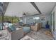Outdoor patio with comfortable seating and television at 75 Spyglass Aly, Placida, FL 33946