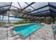 A large screened pool with a spa offers space to lounge by the water at 75 Spyglass Aly, Placida, FL 33946