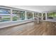 Sunroom features large windows, and a view of the pool and waterway at 75 Spyglass Aly, Placida, FL 33946