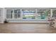 Spacious sunroom with views of the pool, waterway, and backyard at 75 Spyglass Aly, Placida, FL 33946