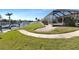 Lush backyard and waterfront access featuring a boat dock and serene water views, inviting relaxation and outdoor activities at 944 Genoa Ct, Punta Gorda, FL 33950