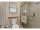 Cozy bathroom with glass shower door and window for natural light at 944 Genoa Ct, Punta Gorda, FL 33950