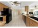 Open-concept kitchen featuring granite countertops and tile flooring at 944 Genoa Ct, Punta Gorda, FL 33950
