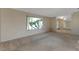 Well-lit living room featuring large windows and neutral decor at 944 Genoa Ct, Punta Gorda, FL 33950